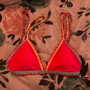 I am selling a small bikini top that is pink, blue, yellow. It is to big for me.